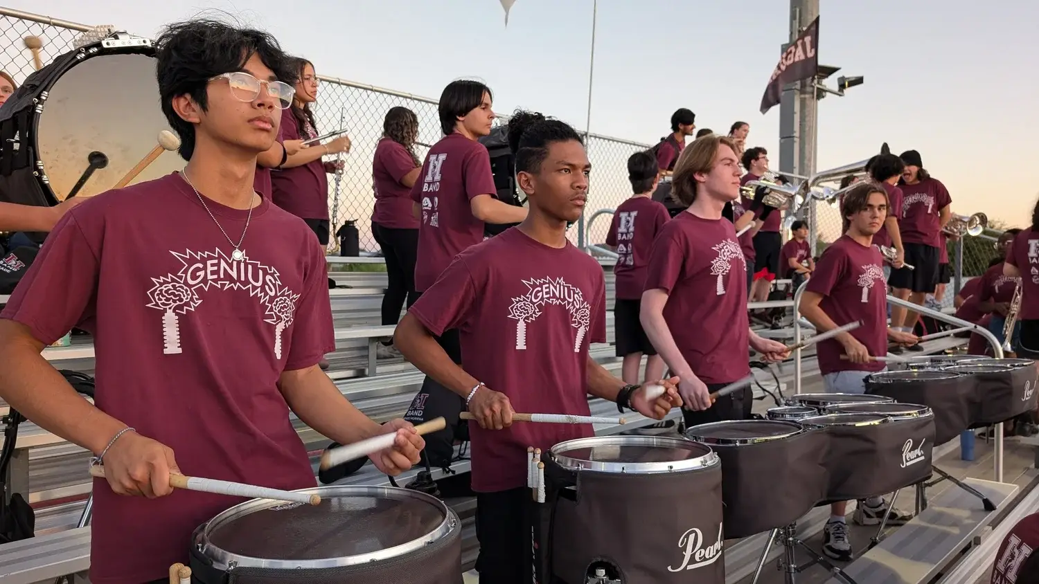 Hamilton drumline playing in the stands at a football game